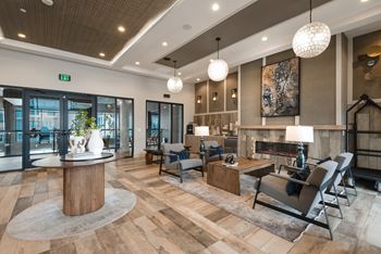 A modern living room with a wooden floor and furniture.